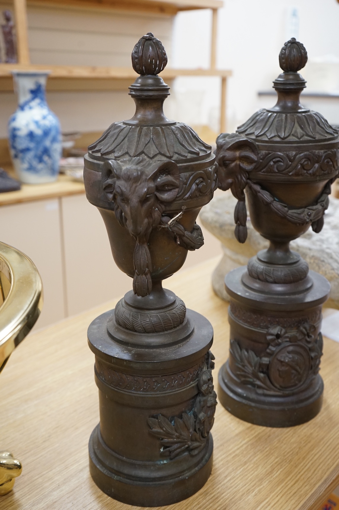 A pair of Grand Tour style bronze rams' head vases, H 55cm W 18cm